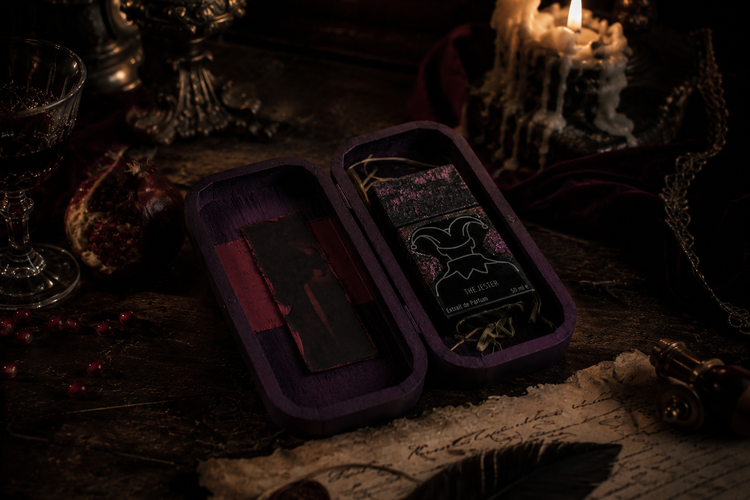 Open presentation box featuring The Jester fragrance in a dark throne room setting
